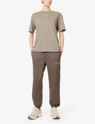 Gymshark Womens Collegiate Brand-print Tapered-leg Mid-rise Cotton-blend Jogging Bottoms Gs Camo Brown In Gs Camo Brown