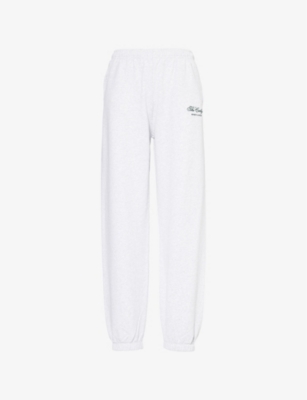 SPORTY & RICH: The Carlyle Script Relaxed Cotton-Jersey Jogging Bottoms