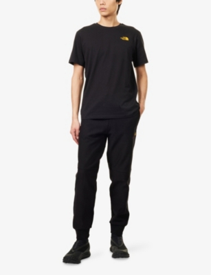 THE NORTH FACE MENS THE NORTH FACE COLLAGE LOGO-PRINT SHORT-SLEEVE COTTON-JERSEY T-SHIRT 