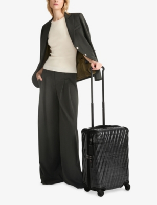 TUMI: International Expandable 4-Wheeled Polycarbonate Carry-on Suitcase 55cm
