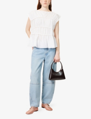 FRAME: Twisted High-Rise Denim Jeans