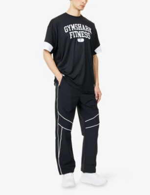 GYMSHARK: Varsity Oversized Woven T-Shirt