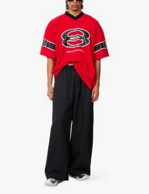 BALENCIAGA: American Football Logo-Print Woven T-Shirt