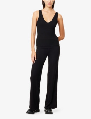 We Are Tala Omens Black 365 Sculpting Roll-waist Flared-leg Stretch-jersey Trousers In Black