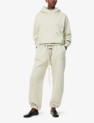 Essentials Womens Embossed-branding Wide-leg Cotton-blend Jogging Bottoms Heather Stone In Neutral