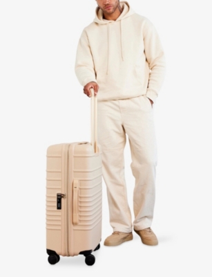 Beis Beige The Medium Check-in Roller 4-wheel Expandable Suitcase In Sand