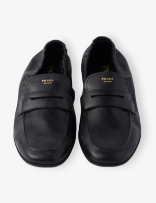 Prada Shuffle Antiqued Screen-printed-logo Loafers In Black