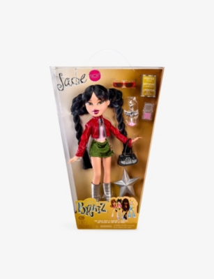 A doll with black hair inside a box with accessories